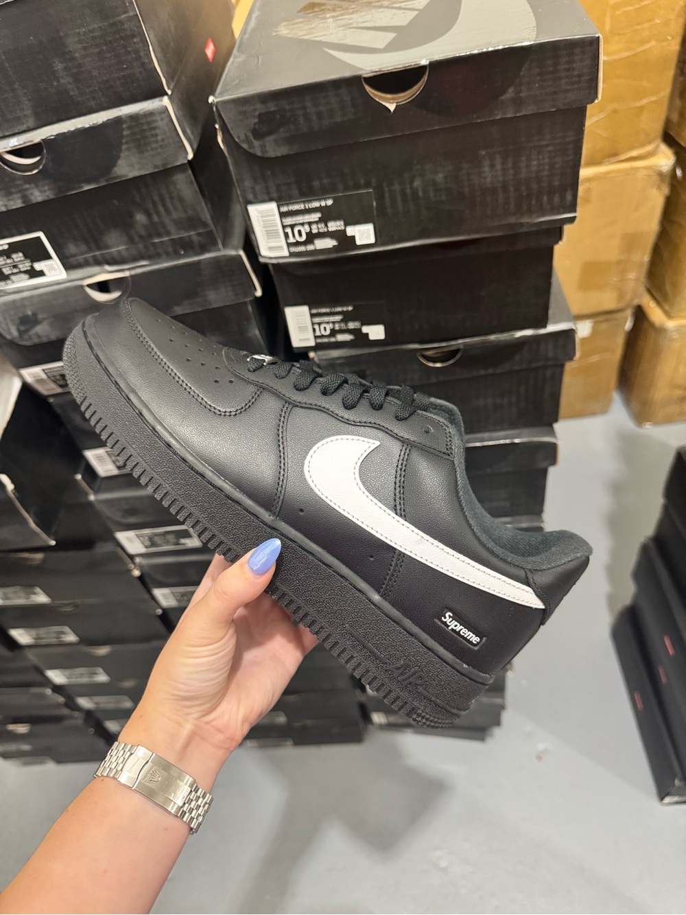 Nike Black Low-Top Sneaker with White Swoosh and Subtle Supreme Tab
